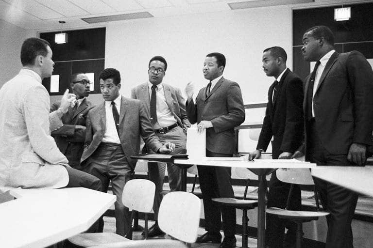 Members of IU’s inaugural class in a 1968 meeting with faculty member