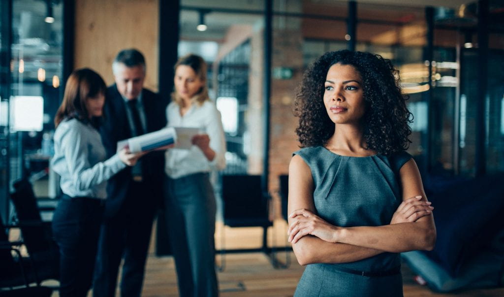 african-american ethnicity woman standing confidently in office looking away